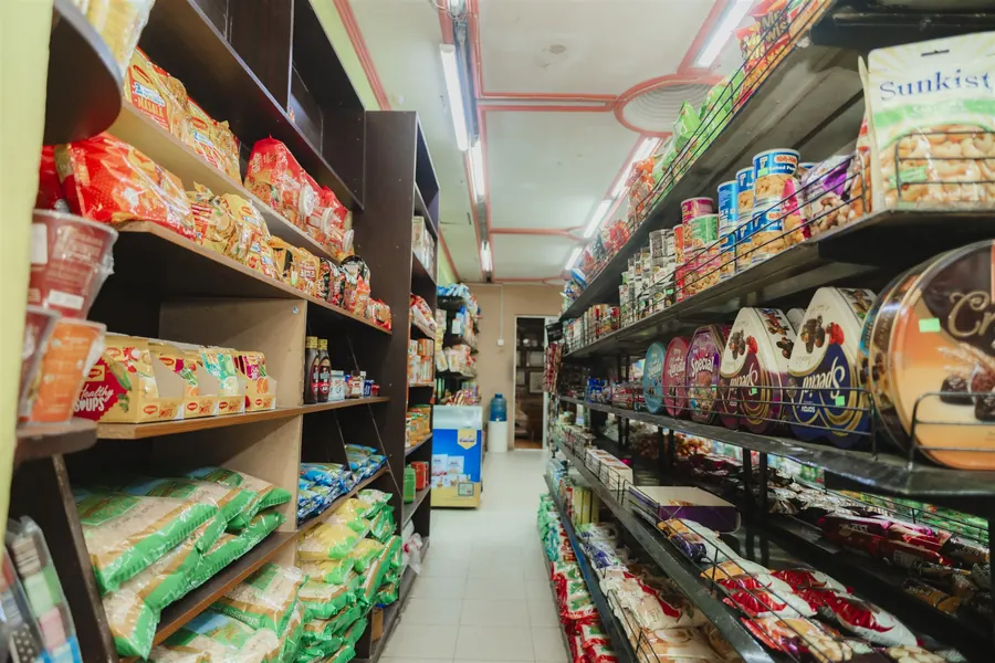 An aisle of biscuits, chocolate tins and snacks